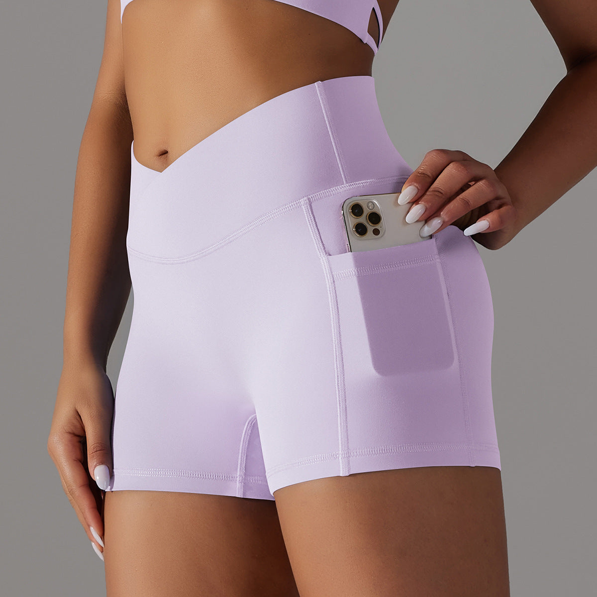 Pantalones cortos de yoga con diseño de bolsillo para teléfono, pantalones deportivos de fitness para mujer.